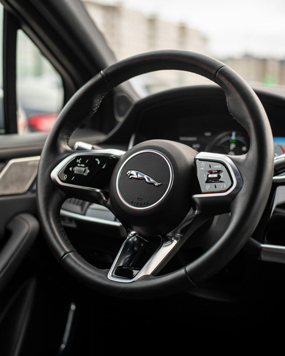 a steering wheel and dashboard of a car