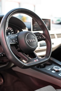 a steering wheel and dashboard of a car