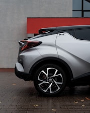 a white car parked on a brick surface
