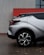 a white car parked on a brick surface