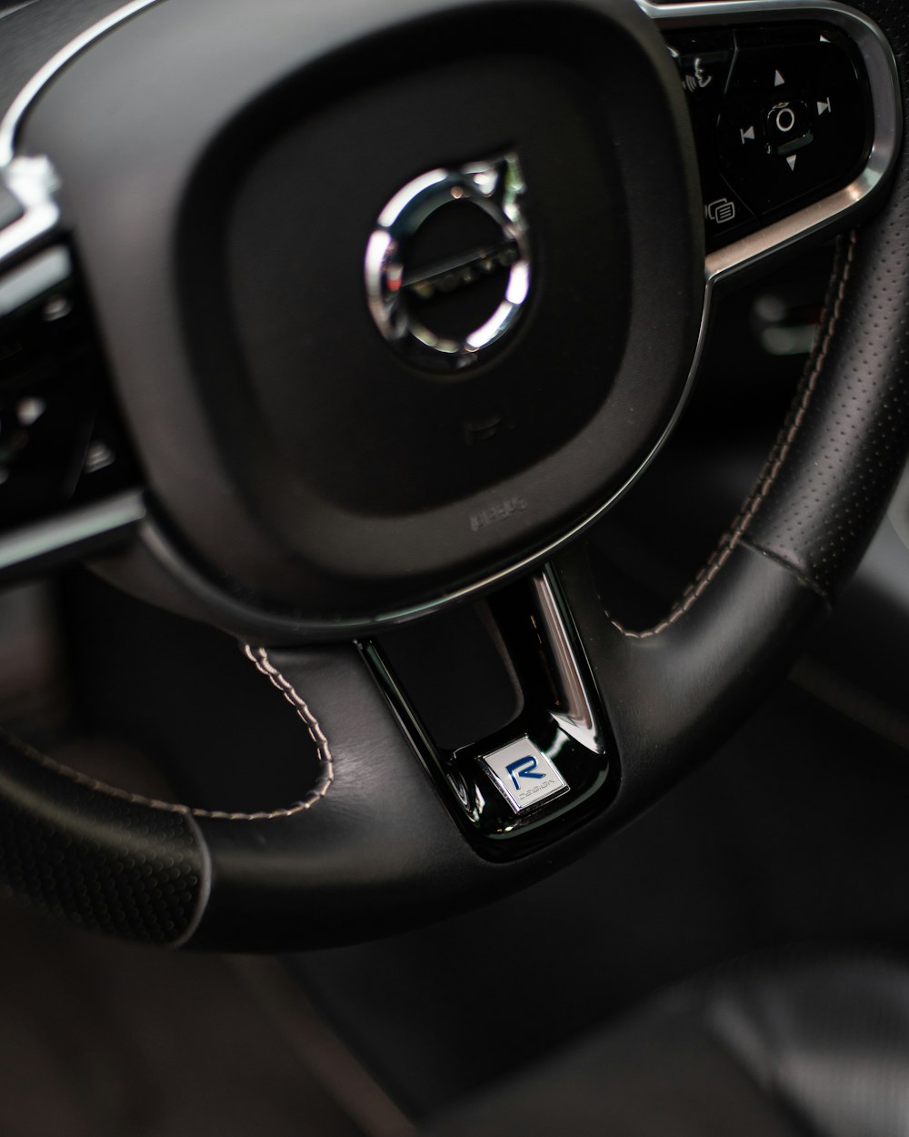 a steering wheel and dashboard of a car