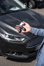 a hand holding a key