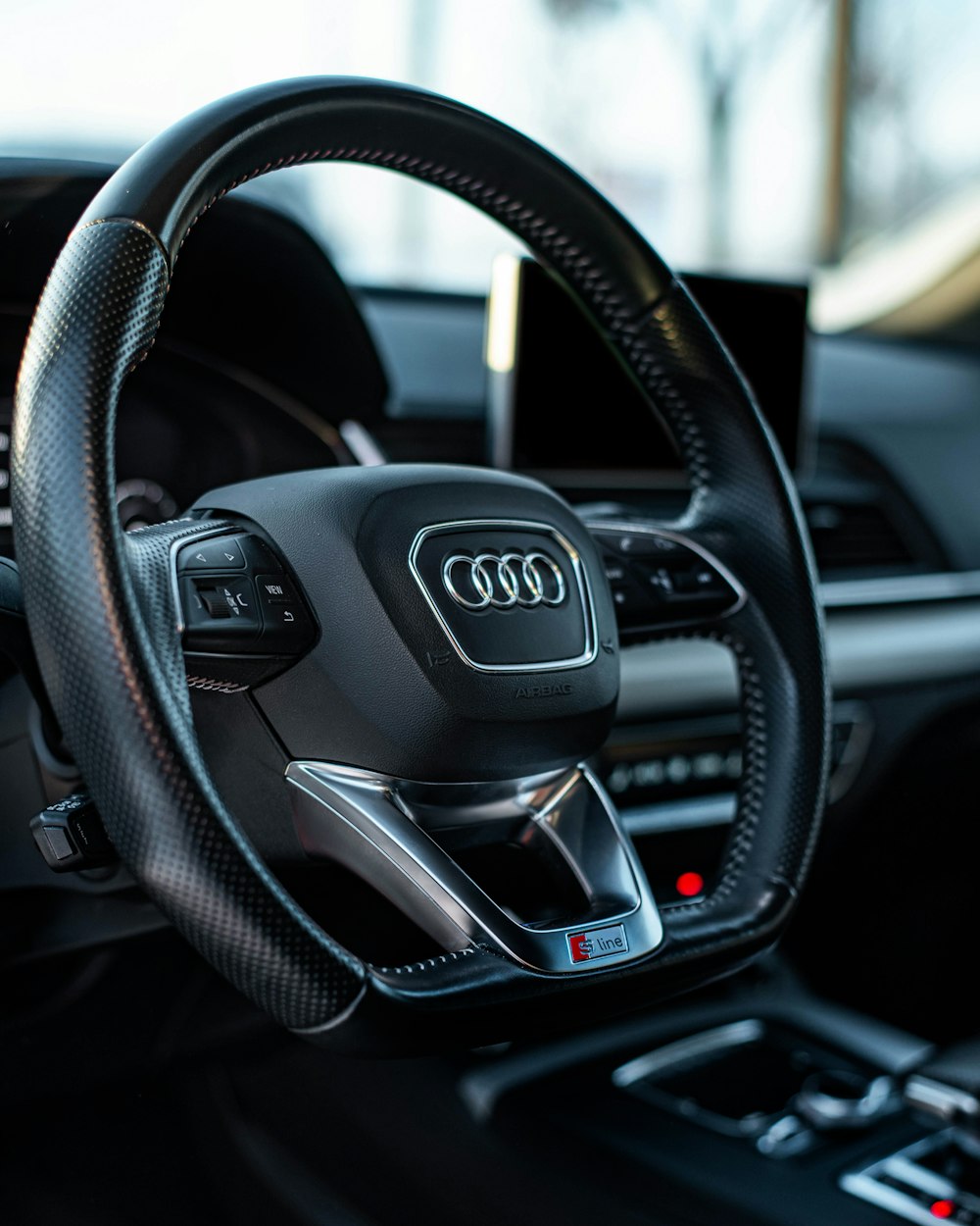 a steering wheel and dashboard of a car