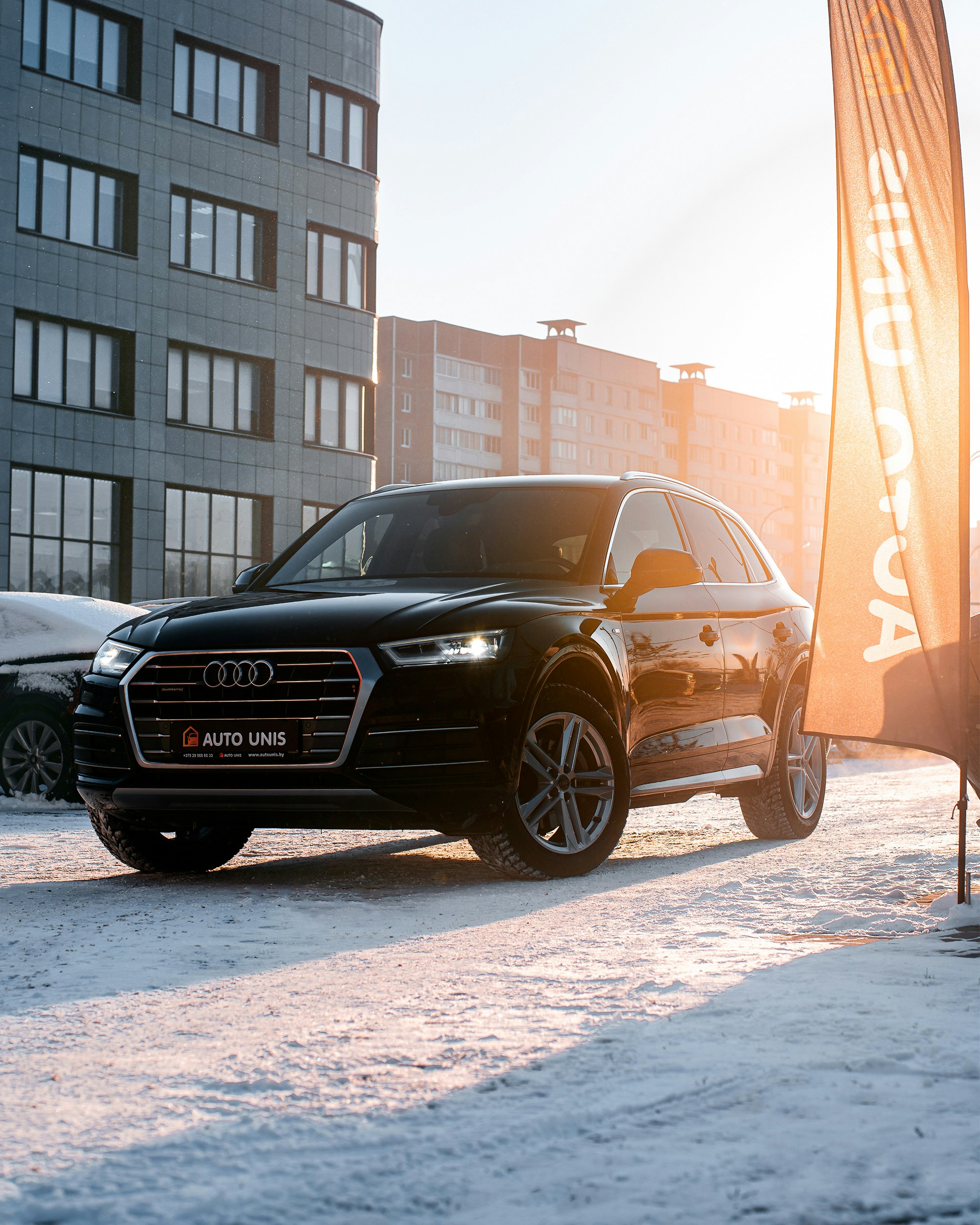 A black car parked in front of a building photo – Free Audi q5 Image on ...