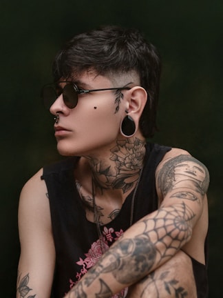 a person wearing glasses and looking at the camera