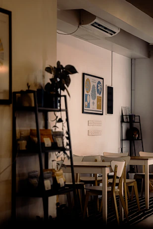 Cozy interior shot of the small takeaway restaurant with warm lighting and inviting seating.