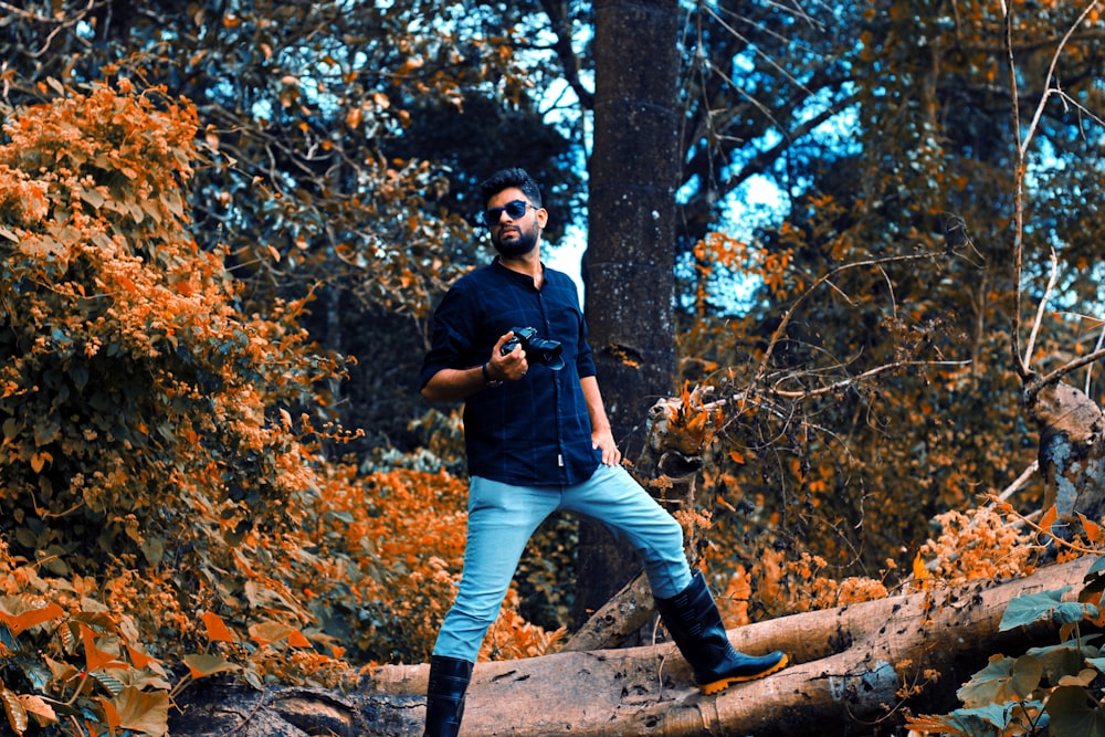 a man standing on a log