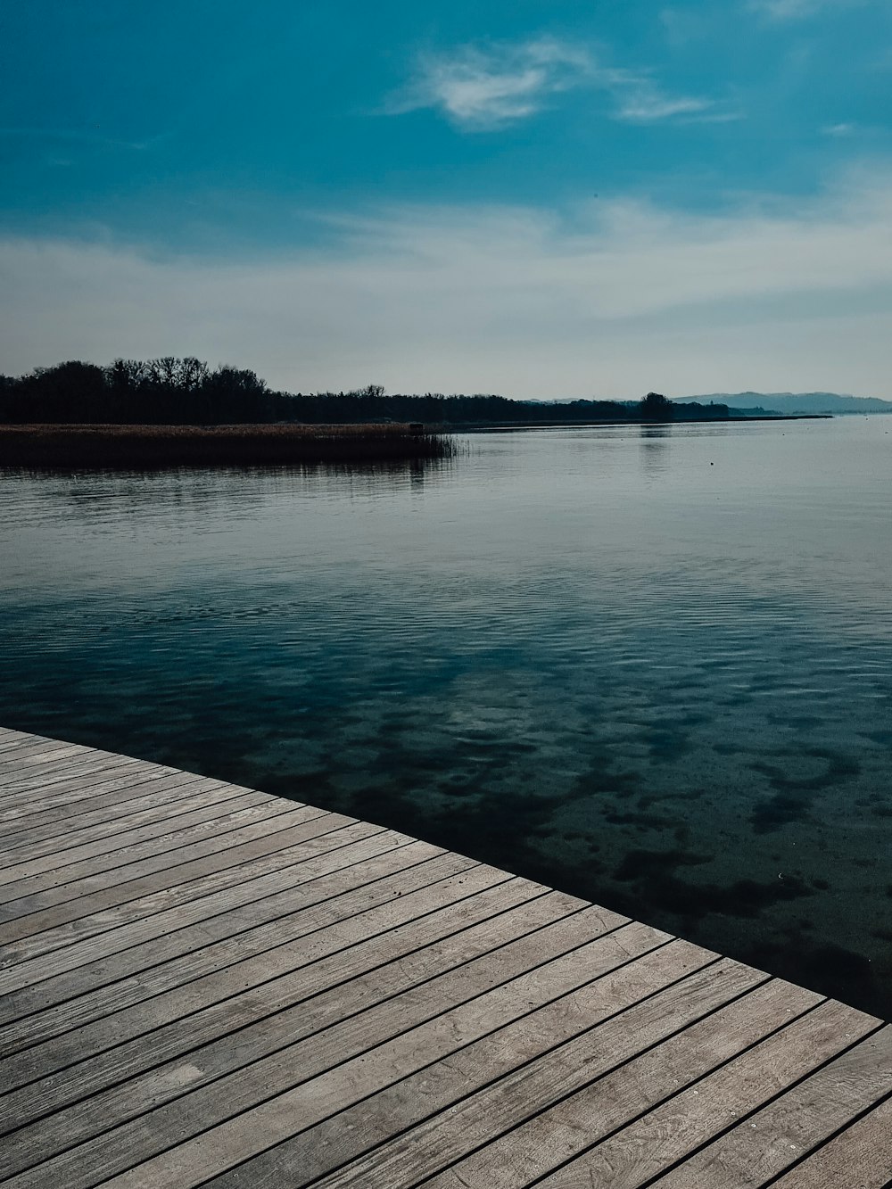 a wood dock over a body of water