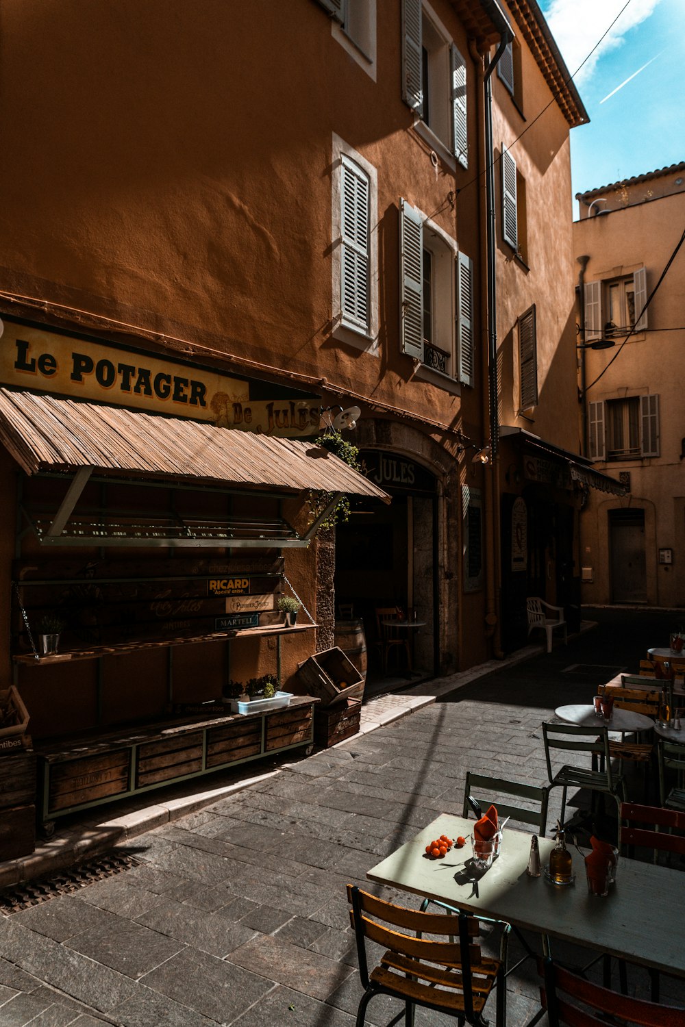 a street with tables and chairs