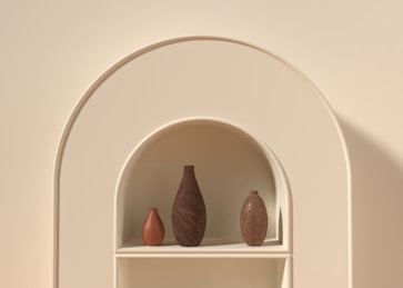 a white shelf with objects on it