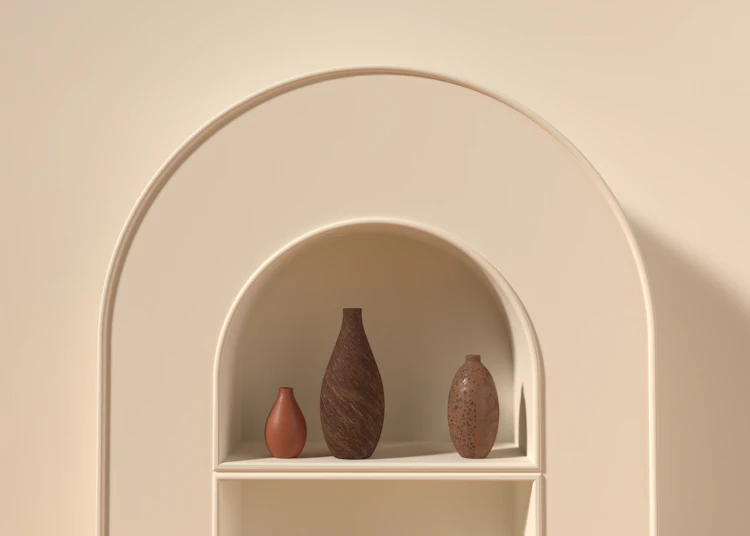 A white shelf with objects on it