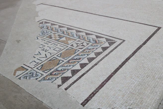 A beautifully tiled mosaic floor with intricate geometric designs reflecting Mediterranean influences.