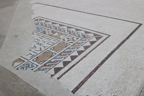 A close-up of intricate tile patterns on a floor.