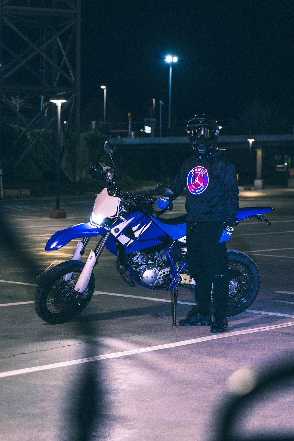 a police officer standing next to a motorcycle