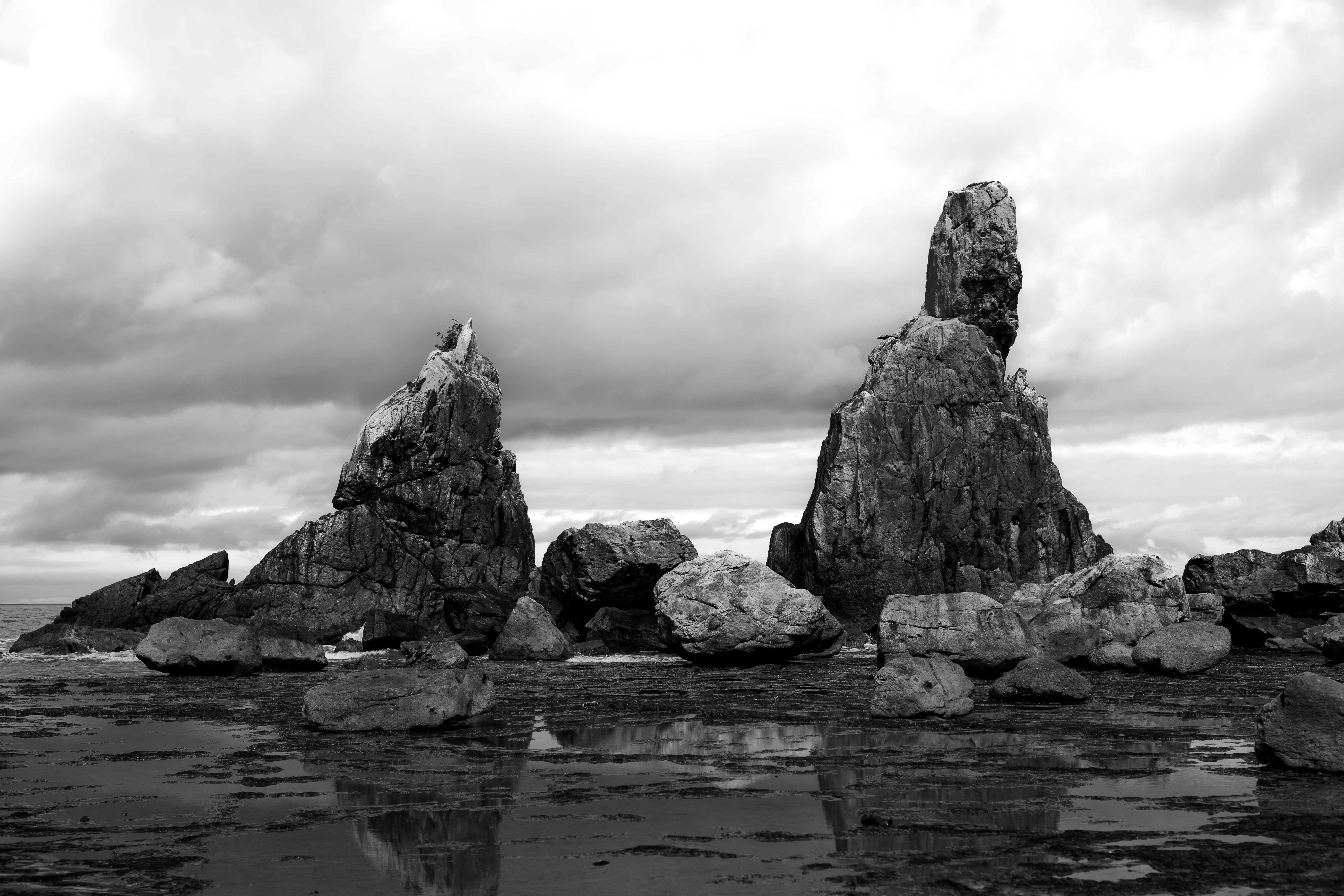 a body of water with large rocks in it
