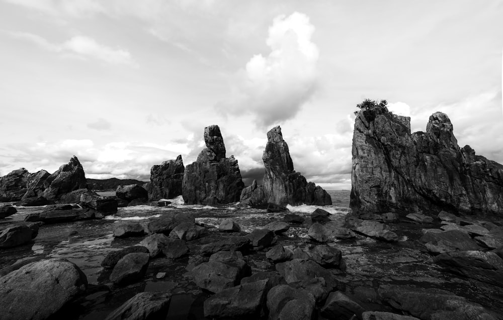 a rocky landscape with a cloudy sky