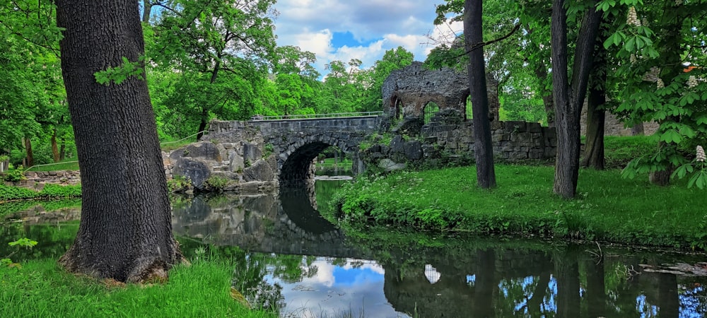 a stone bridge over a river