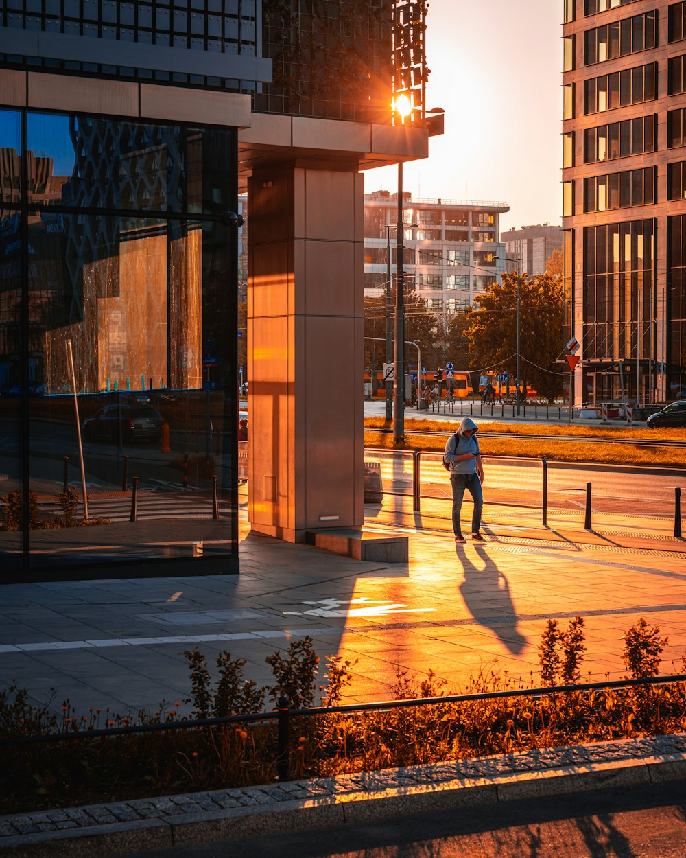 a person walking on a sidewalk