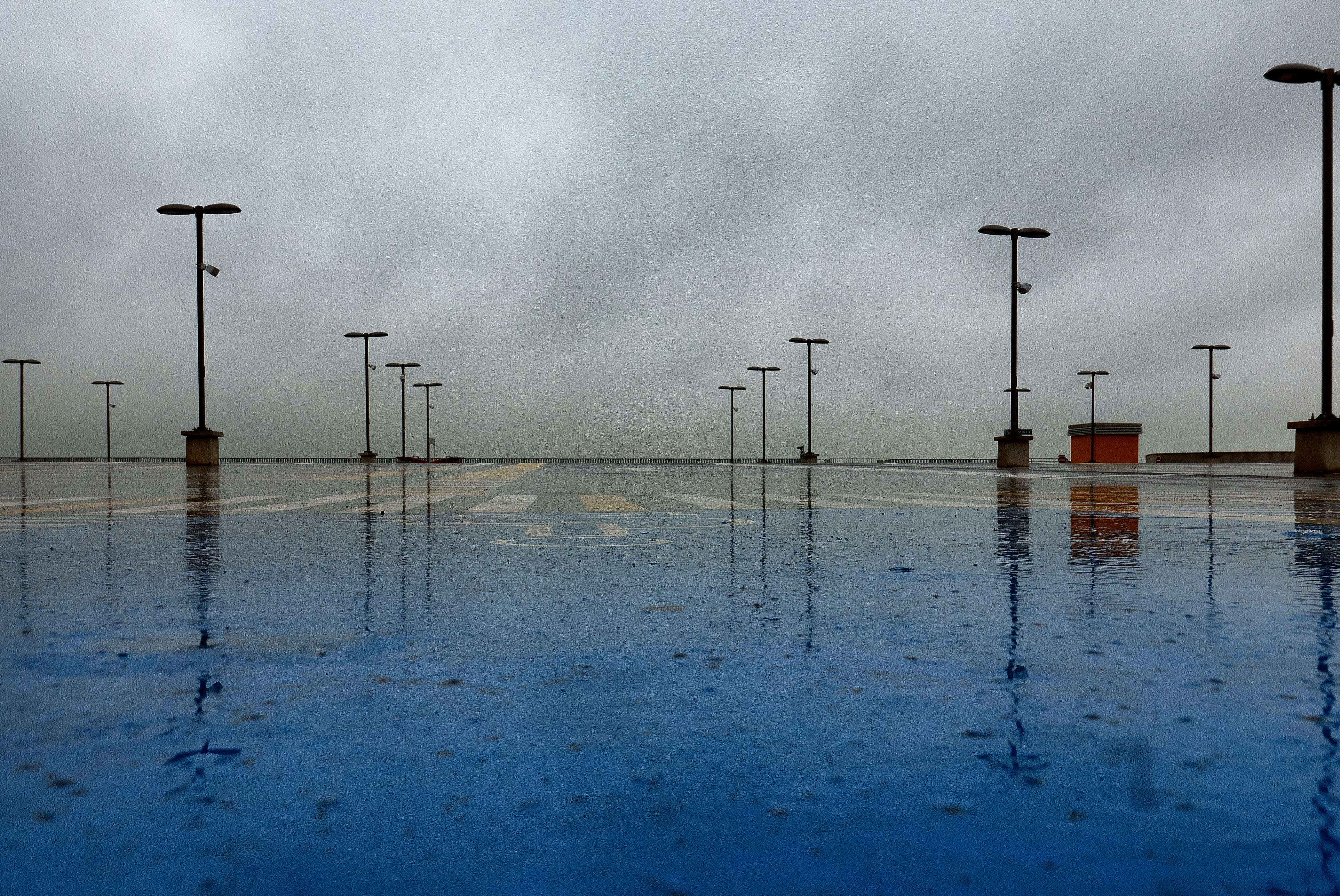 a group of wind turbines in a large body of water