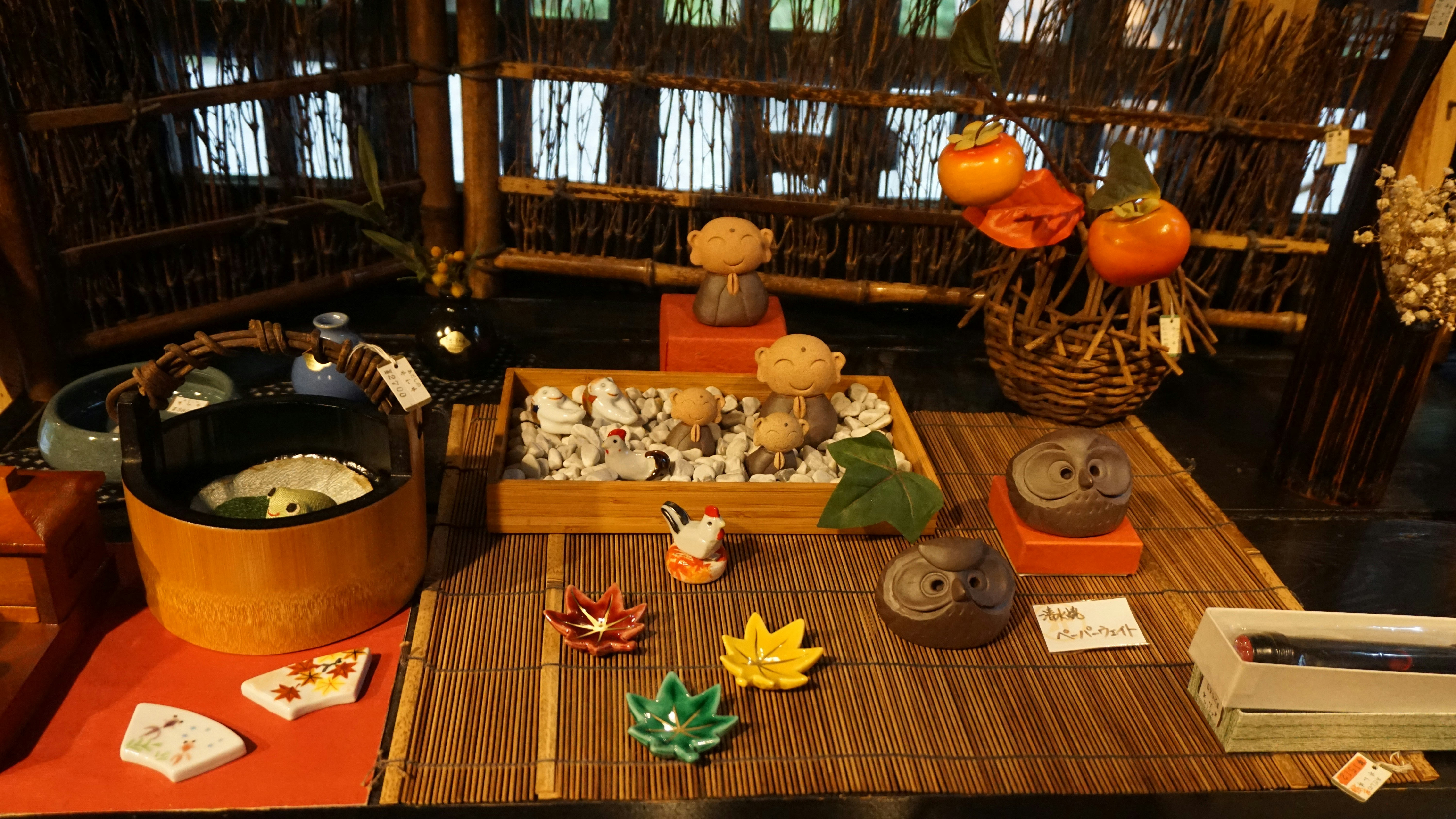a table with a basket of vegetables and a basket of pumpkins, 
