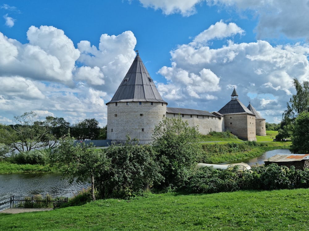 a castle with a pond in front of it