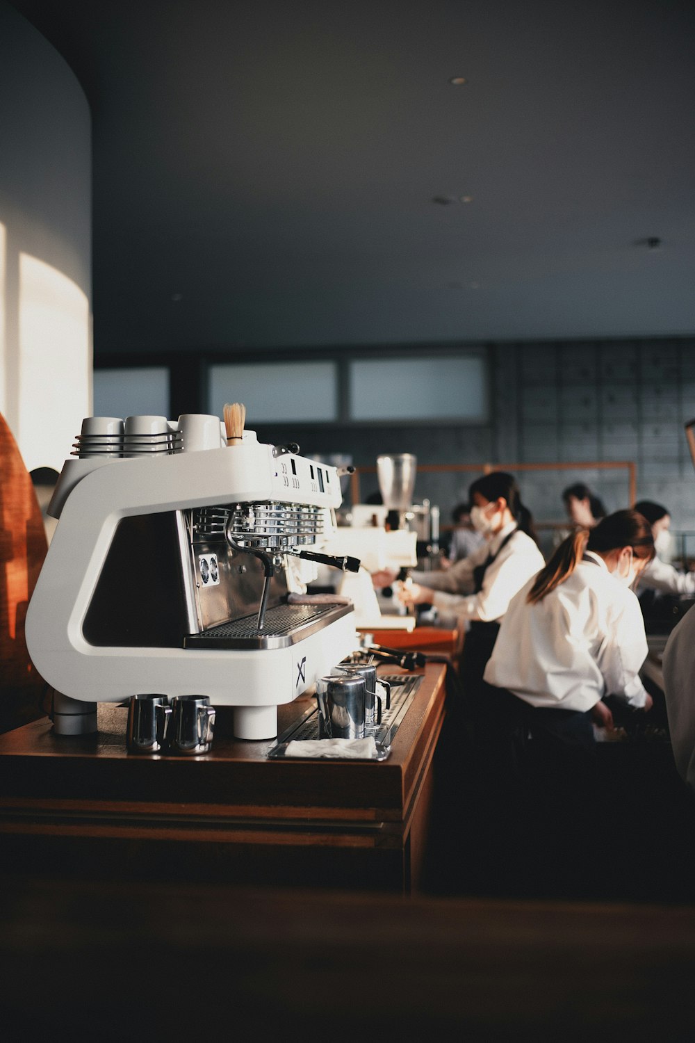 a group of people in a kitchen