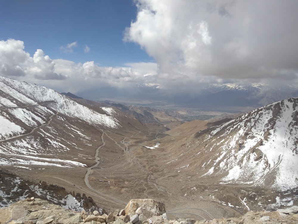 a mountain range with clouds