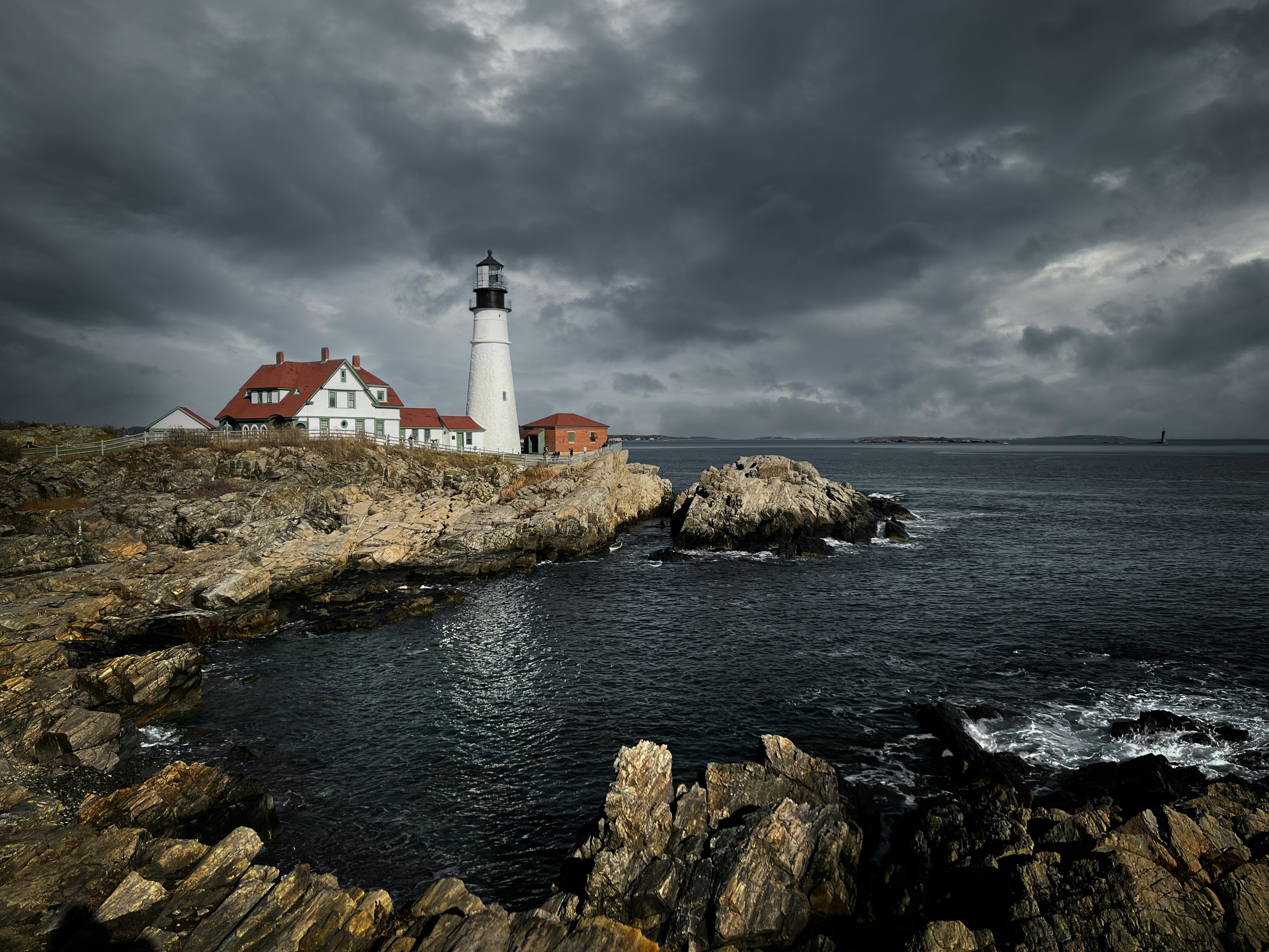 a lighthouse on a rocky shore
