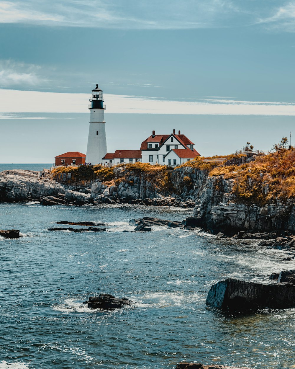 a lighthouse on a rocky island