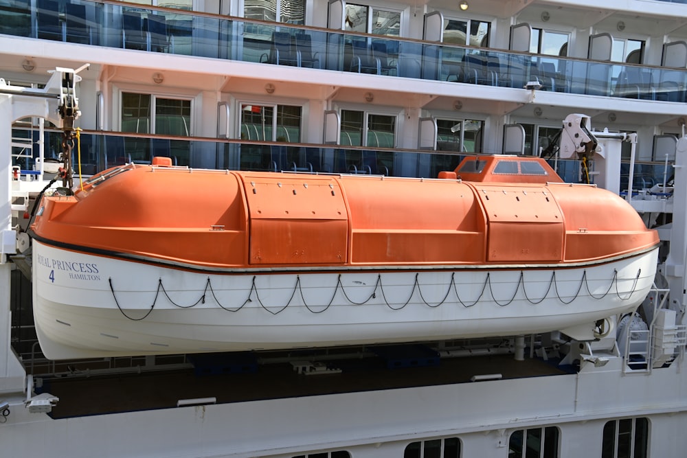 a large orange and white boat