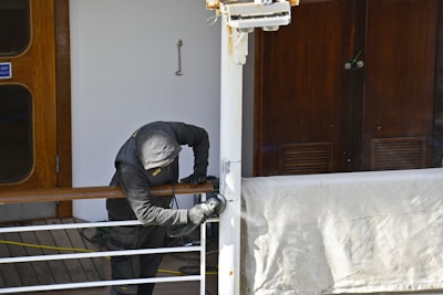 a person in a uniform climbing a ladder