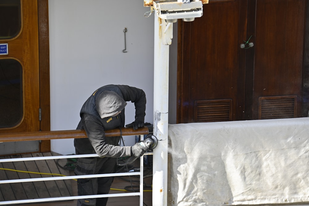 a person in a uniform climbing a ladder