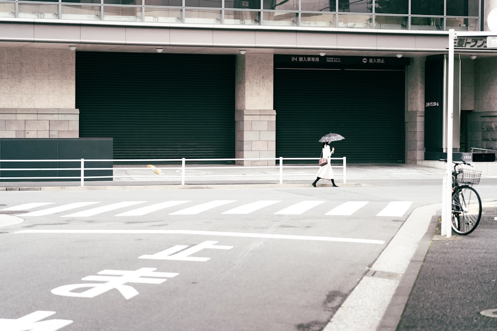 a person walking across a crosswalk