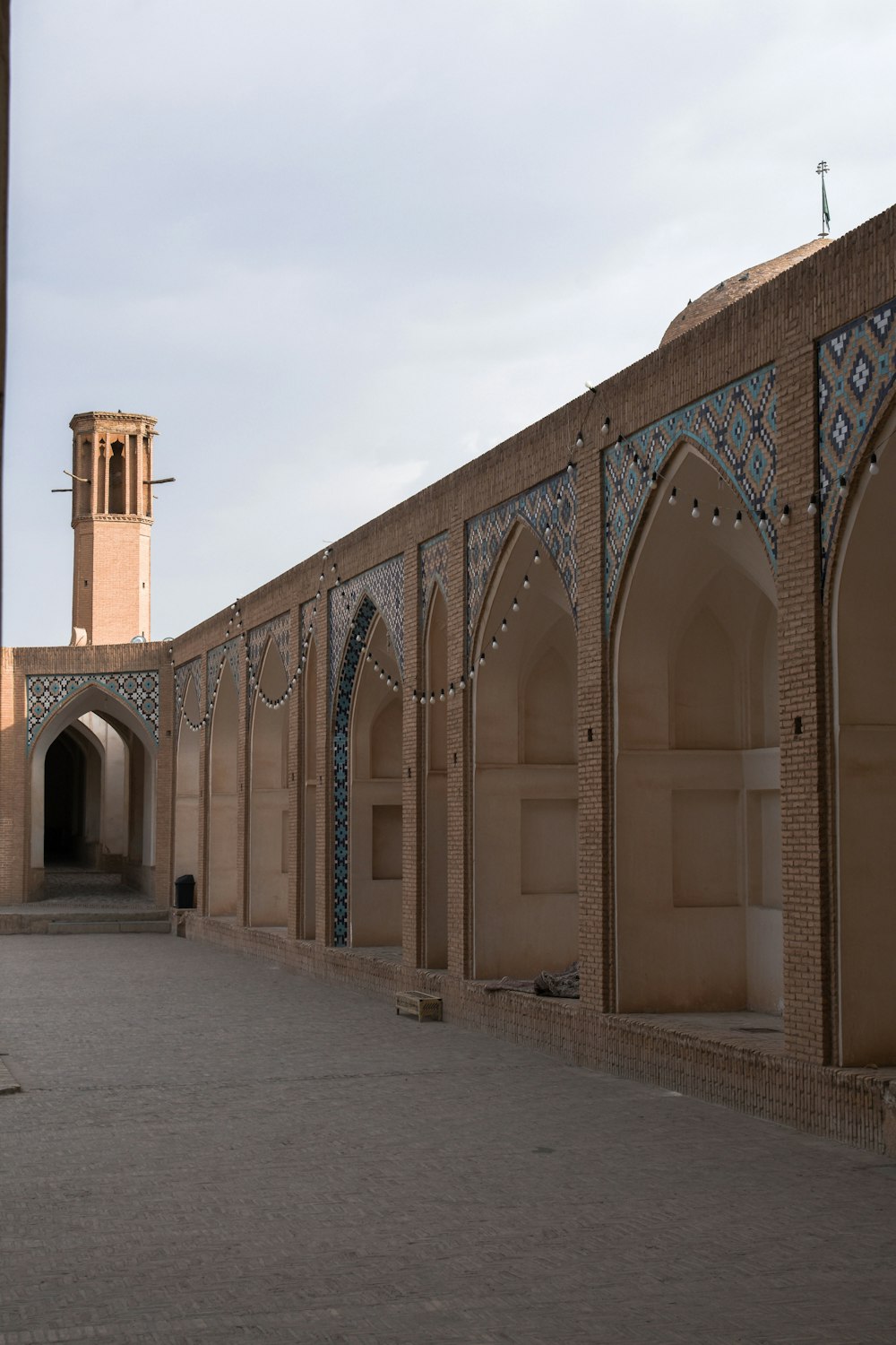 a large building with a clock tower in the background