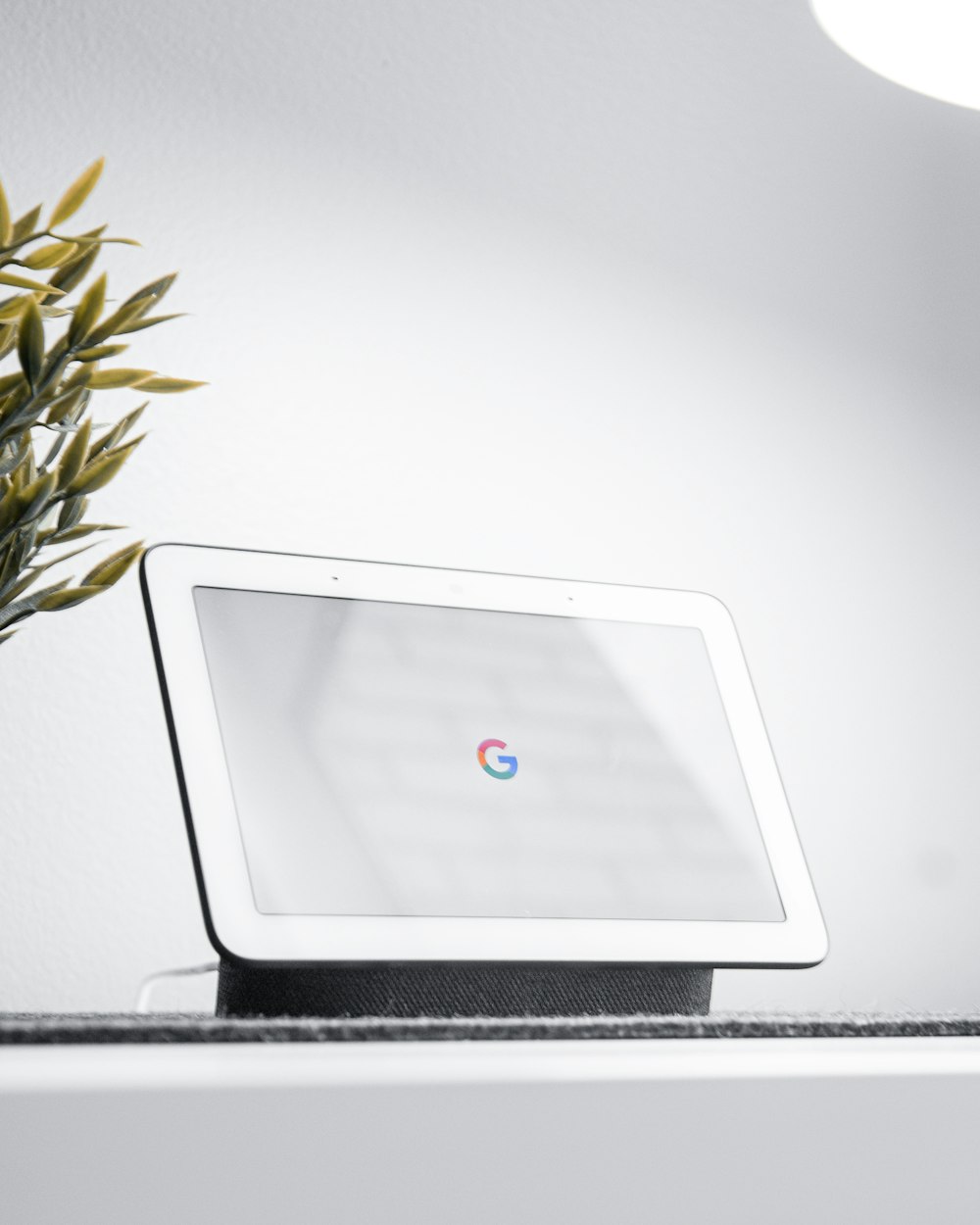 a white computer monitor sitting on top of a desk