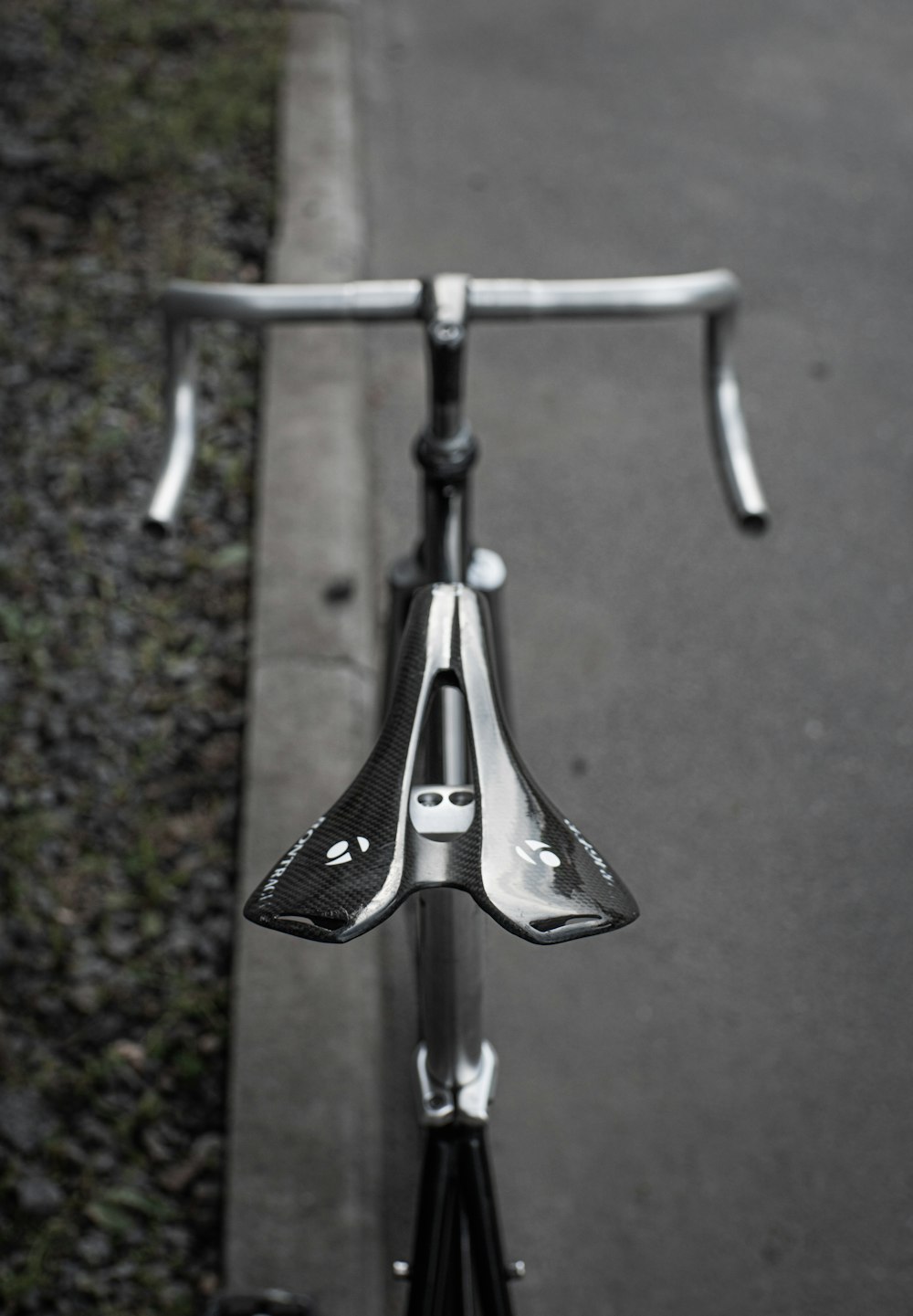 a close up of a bike handlebar on a road