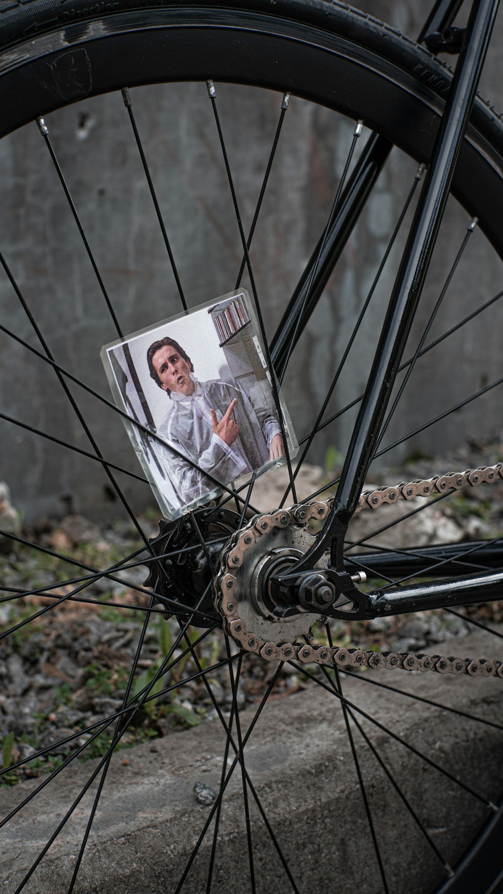 a bicycle wheel with a picture of a man on it