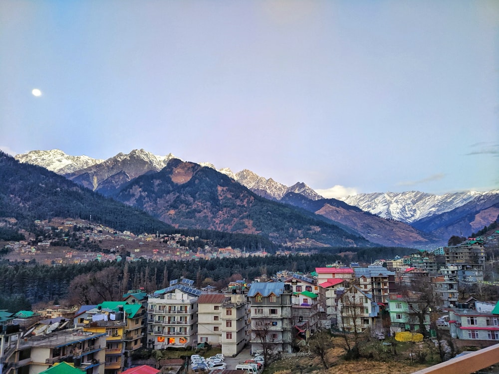 a view of a city with mountains in the background