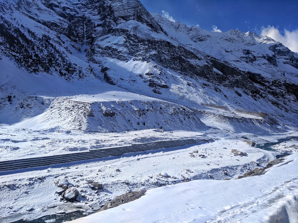 a train traveling through a snow covered mountain