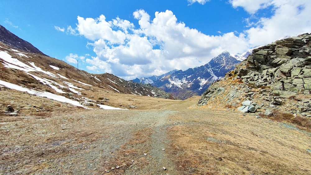 a dirt road in the middle of a mountain range