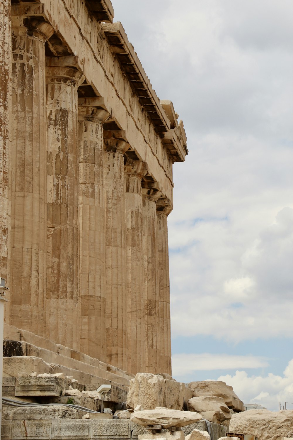 a large stone structure with columns on the side of it