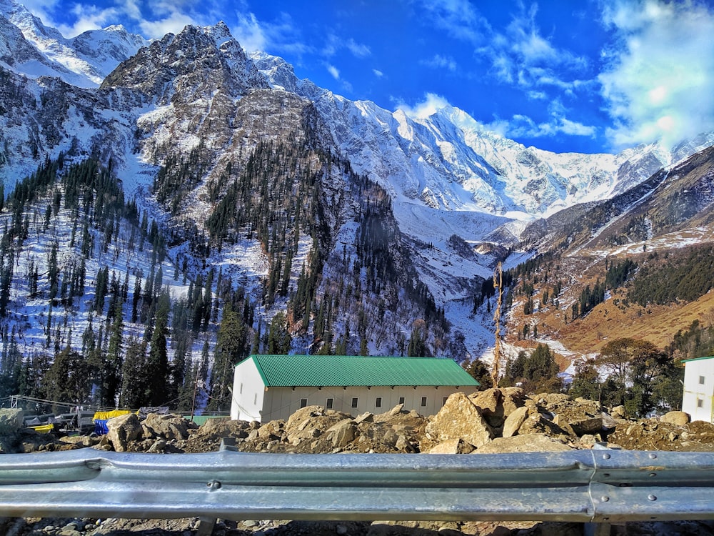 a view of a mountain range with a building in the foreground