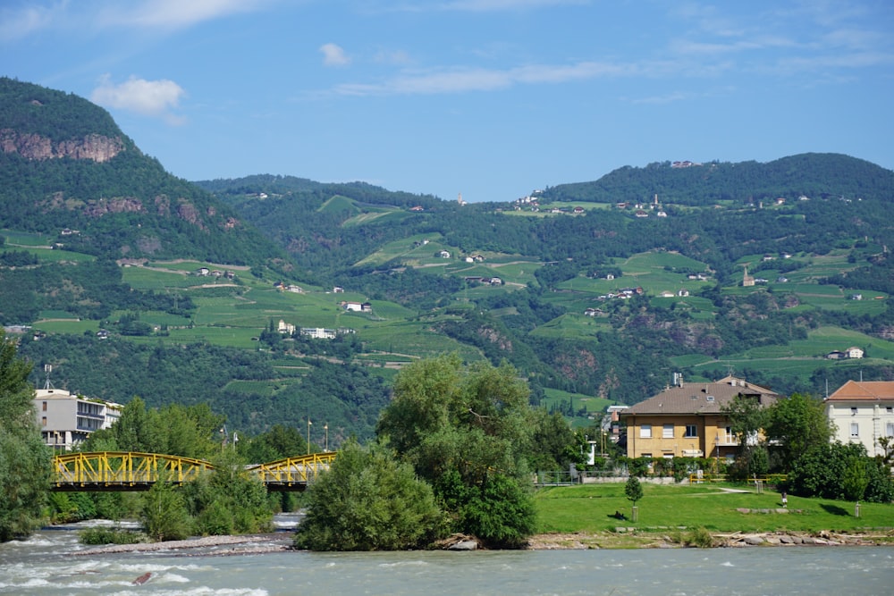 a river running through a lush green countryside