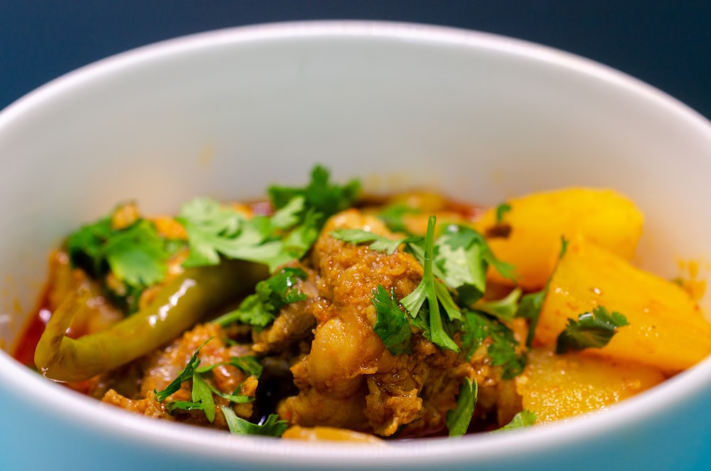 a close up of a bowl of food on a table