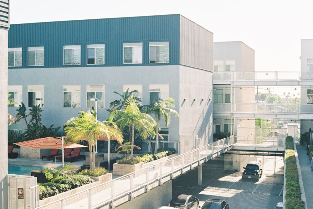 a view of a parking lot with a building in the background