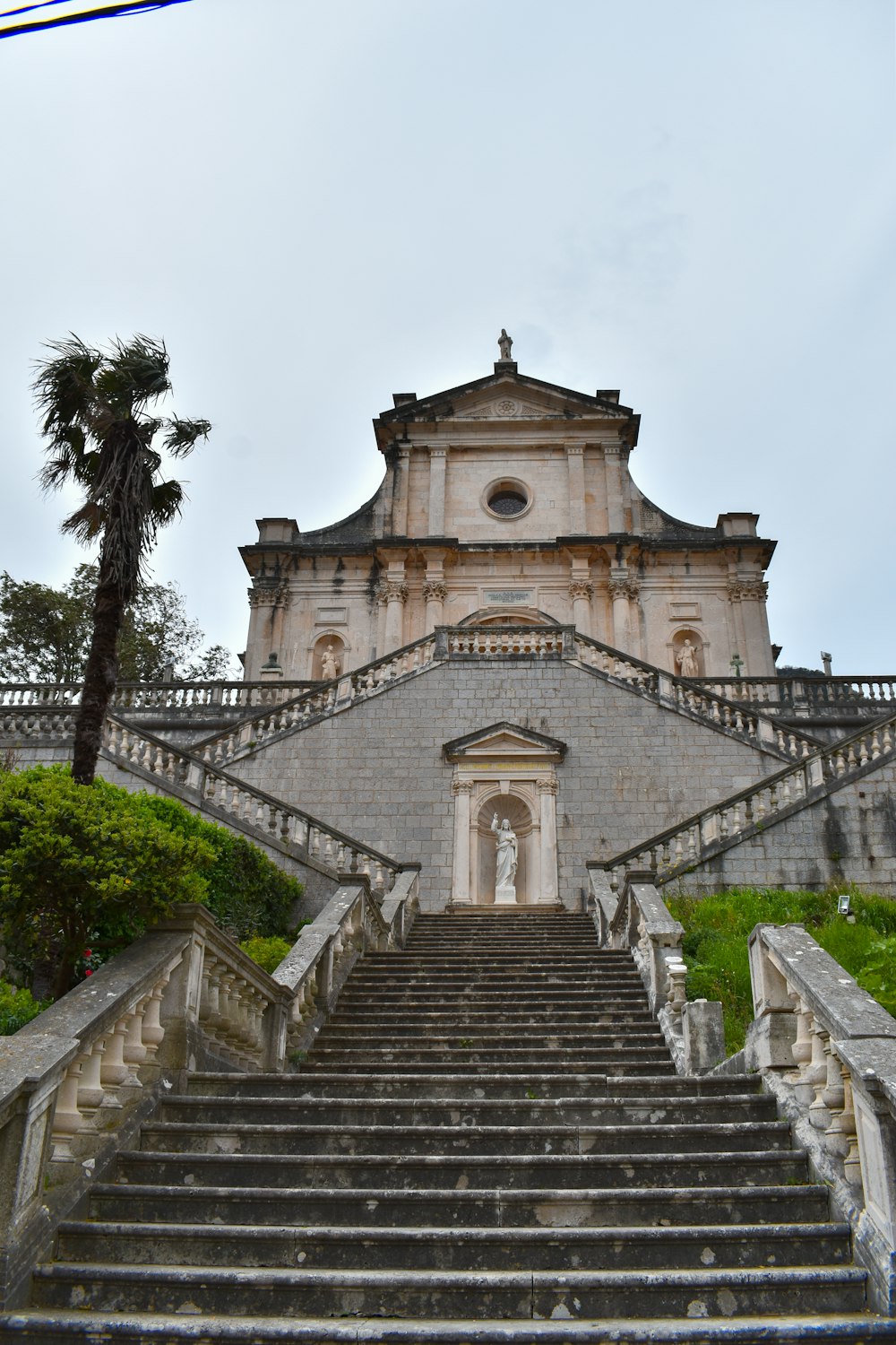 a very tall building with stairs leading up to it