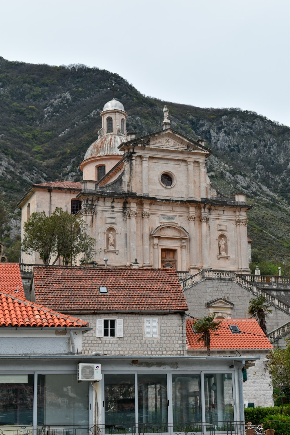 an old church with a steeple in the background