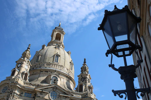 Exterior view of the Asambasilika Altenmarkt with its baroque architecture under a bright sky.