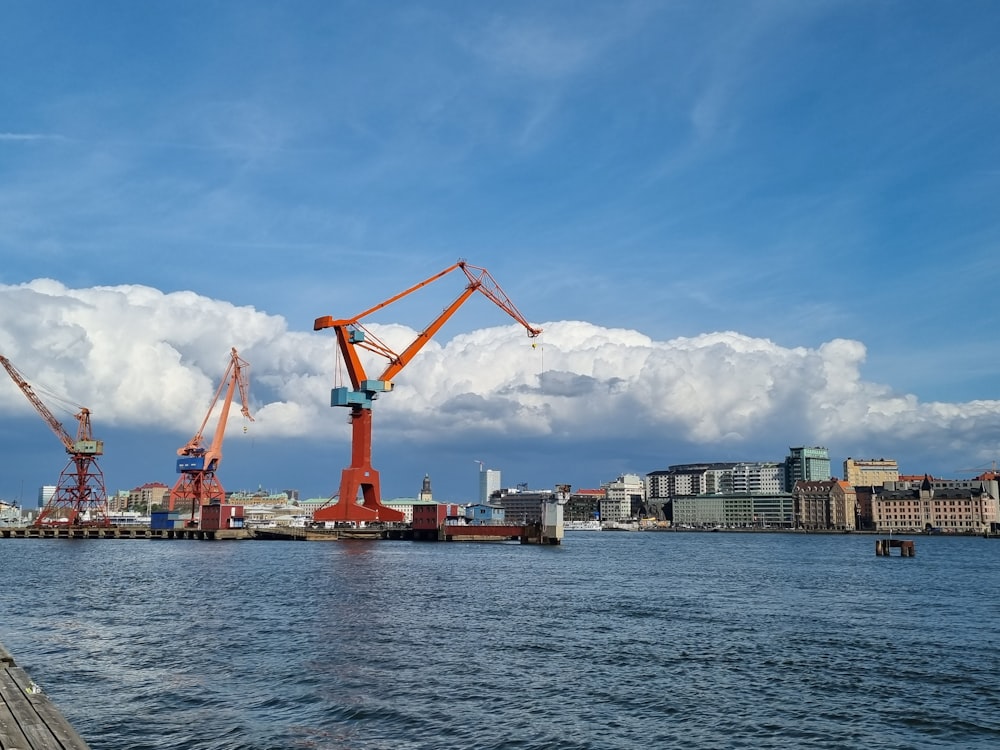 a large crane sitting on top of a body of water