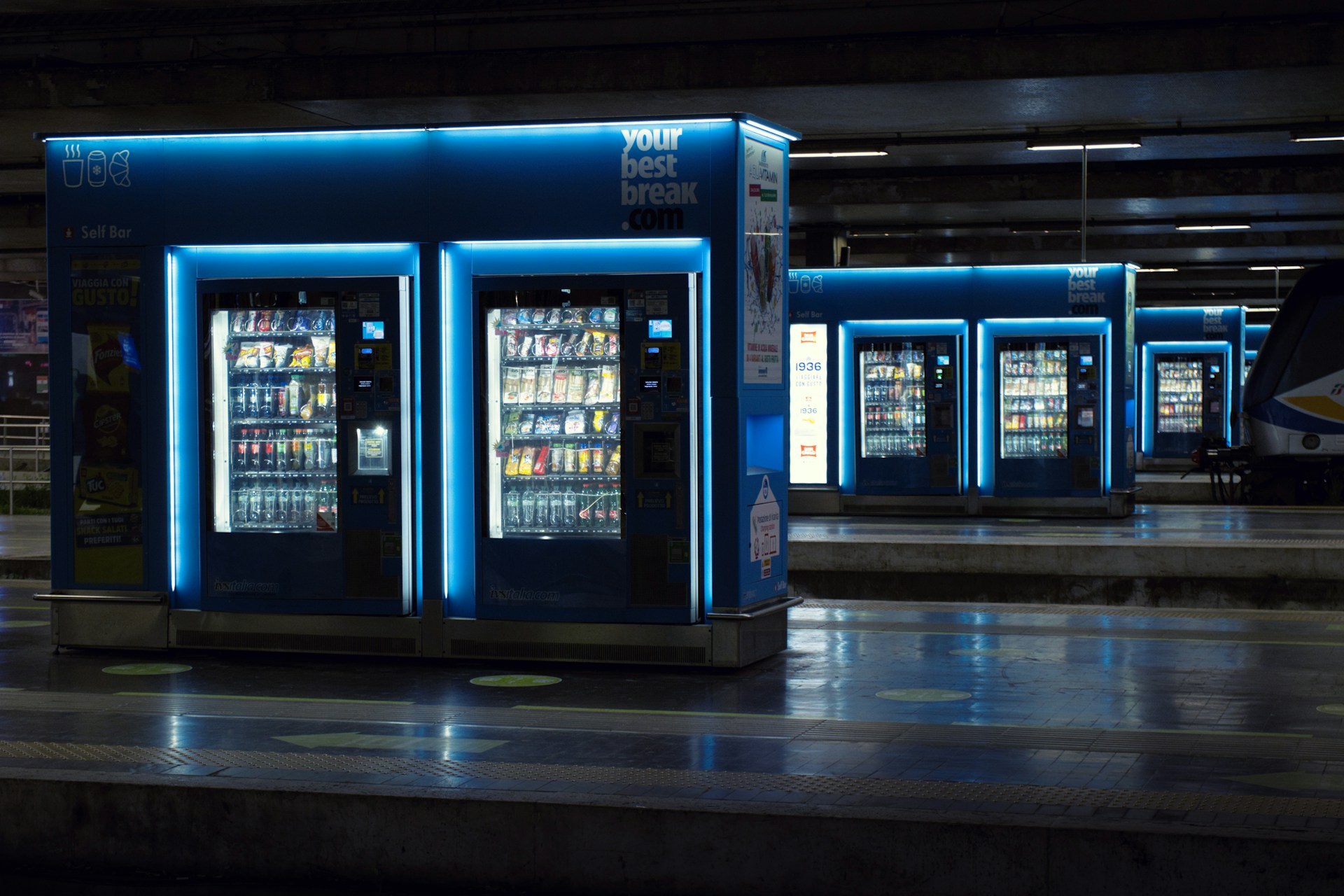 a row of vending machines sitting next to each other